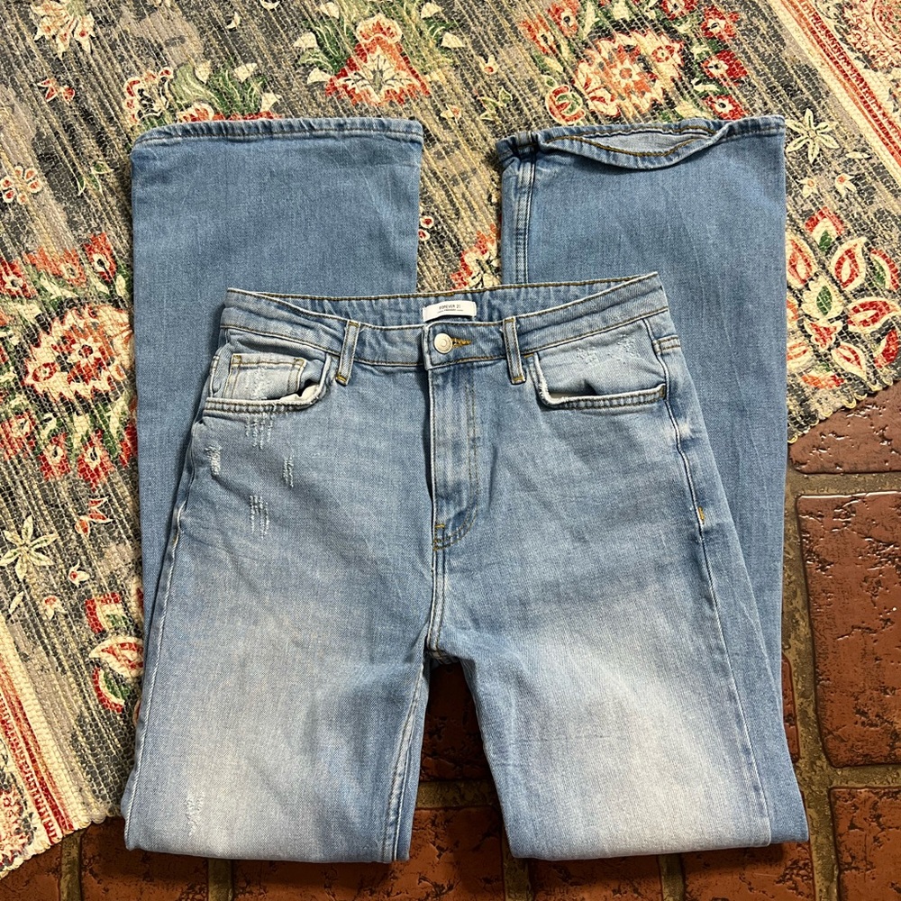 Forever 21 light wash factory distressed flare denim jeans